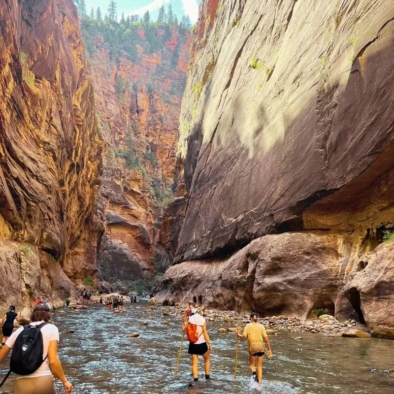 Students hiking through a river canyon at our therapeutic boarding school for boys in Utah.