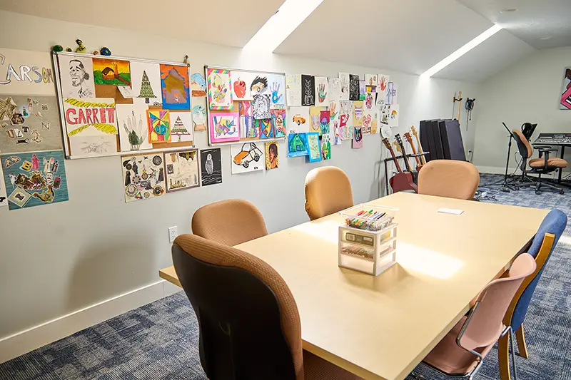 Arts and crafts are displayed on the wall